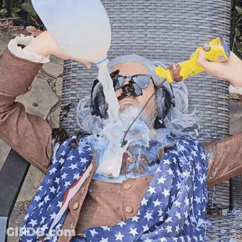 Man In American Flag Outfit Being Poured Milk GIF