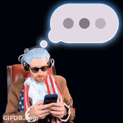 Man In American Flag Scarf And Headphones Looking At Phone GIF