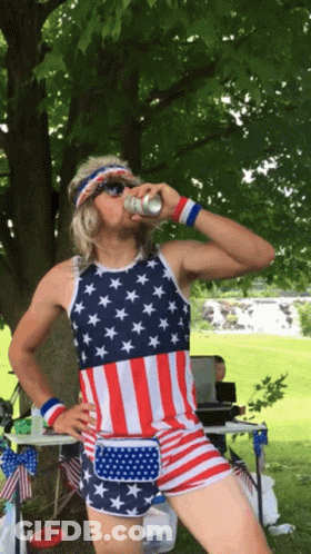 Man In American Flag Tank Top Drinking GIF