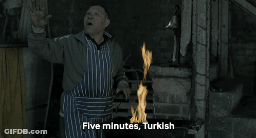 Man In Apron By Fire Saying Five Minutes Turkish GIF