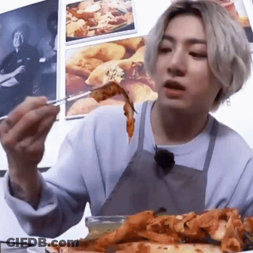 Man In Apron Eating Pizza With Chopsticks GIF