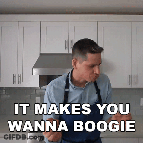 Man In Apron In Kitchen Says It Makes You Wanna Boogie GIF