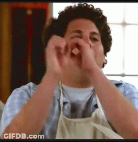 Man In Apron Making Heart Shape GIF