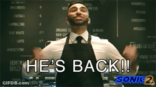 Man In Apron Says He's Back At Menu Board GIF