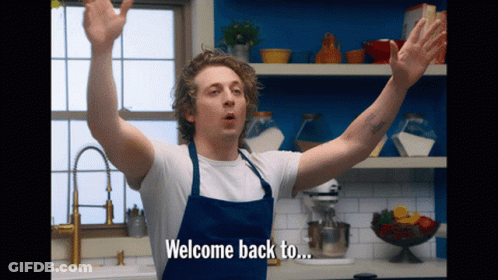 Man In Apron Says Welcome Back To GIF