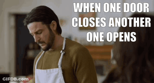Man In Apron Standing In Front Of Door Saying When One Door Closes Another Opens GIF