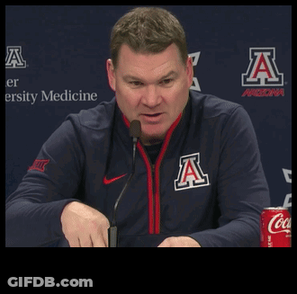 Man In Arizona Jacket Talking Into Microphone GIF