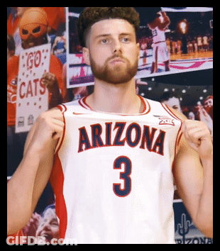 Man In Arizona Jersey Holding Fist Up GIF