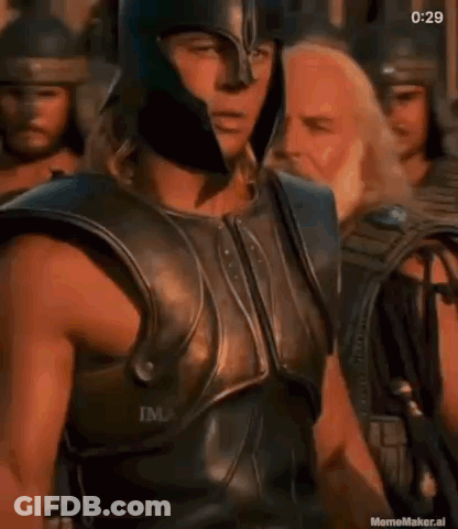 Man In Armor And Helmet Standing Before Crowd GIF