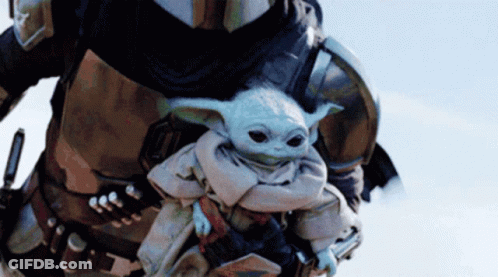 Man In Armor Carrying Baby Yoda GIF