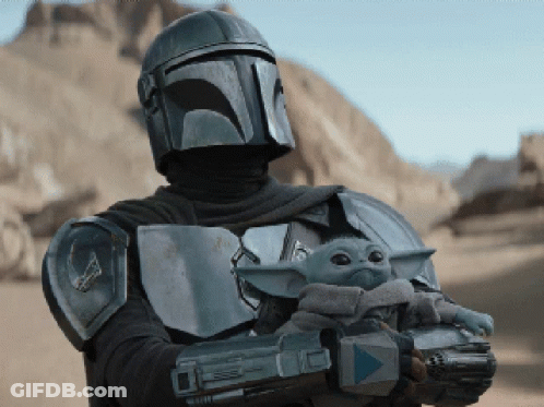 Man In Armor Holding Baby And Gun GIF