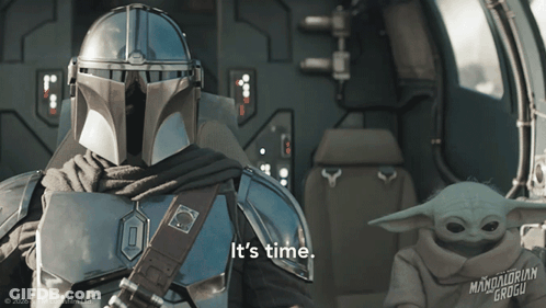 Man In Armor Holding Baby Says I Guess You Sit Right Here GIF