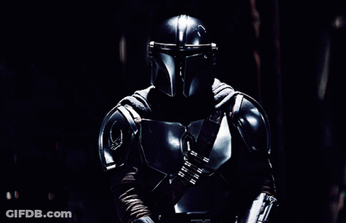 Man In Armor Holding Lightsaber GIF