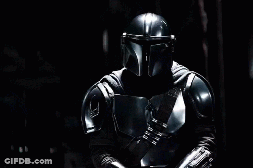 Man In Armor Holding Lightsaber GIF