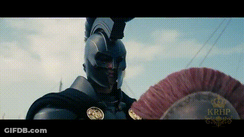 Man In Armor Holding Red Feathered Helmet GIF