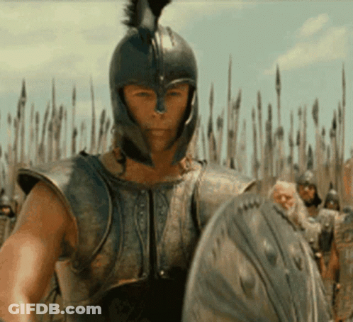 Man In Armor Holding Shield Before Crowd GIF