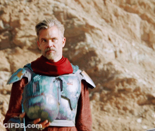 Man In Armor Holding Vase GIF