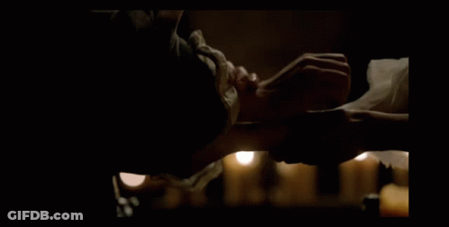 Man In Armor Kneeling With Hands On Chest GIF