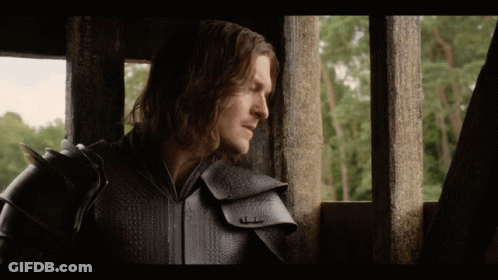 Man In Armor Looks Out Of Window With Trees GIF