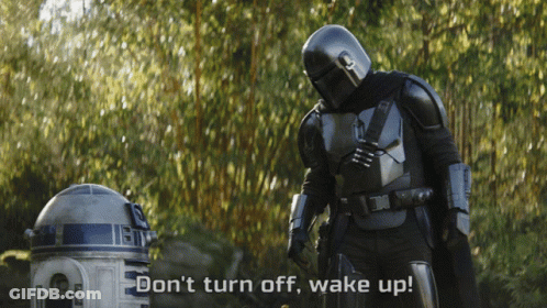 Man In Armor Next To R2D2 Says Wake Up GIF