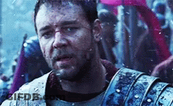 Man In Armor Standing Before Crowd GIF
