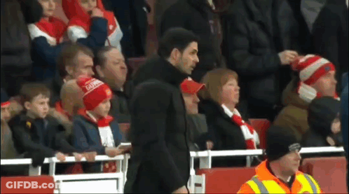 Man In Arsenal Hat In Front Of Crowd GIF