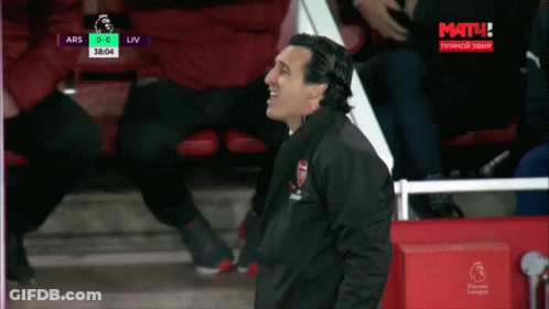 Man In Arsenal Jacket In Front Of Screen Saying Mat GIF