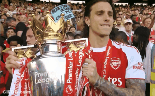 Man In Arsenal Jersey Holding Trophy GIF