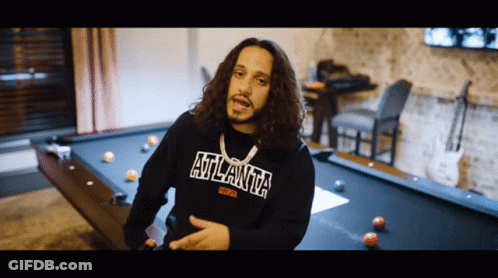 Man In Atlanta Sweatshirt By Pool Table GIF