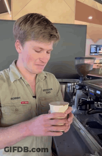 Man In Australia Zoo Shirt Holding Cup GIF