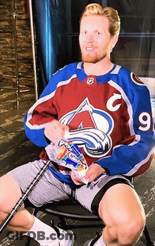 Man In Avalanche Jersey Holding Toothpaste GIF