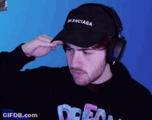 Man In Balenciaga Hat Adjusting Headphones GIF