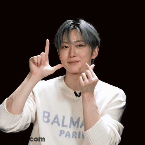 Man In Balma Paris Sweater Making Heart Shape GIF