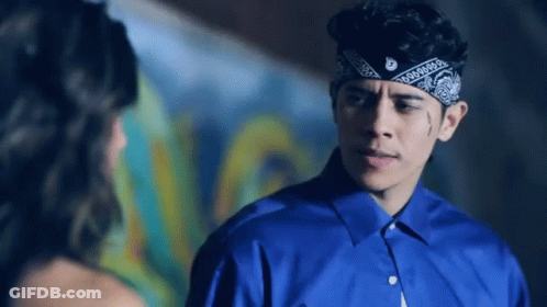 Man In Bandana And Blue Shirt Looking At Woman GIF