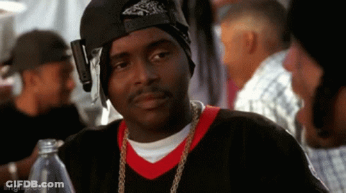 Man In Bandana And Hat Sitting At Table With Water Bottle GIF