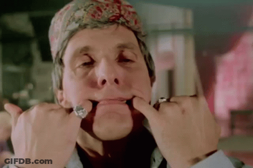 Man In Bandana Making Funny Face With Hands GIF