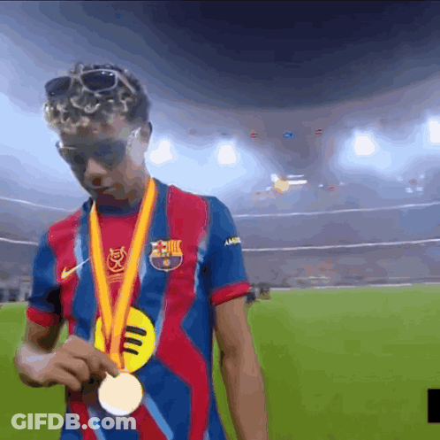 Man In Barcelona Shirt Holding Gold Medal GIF