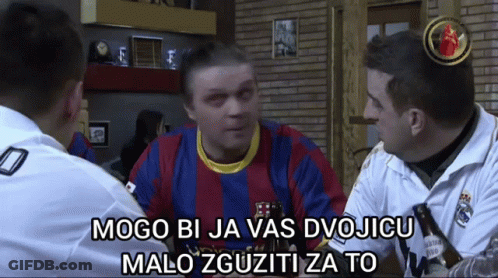 Man In Barcelona Shirt Talking To Two Men GIF
