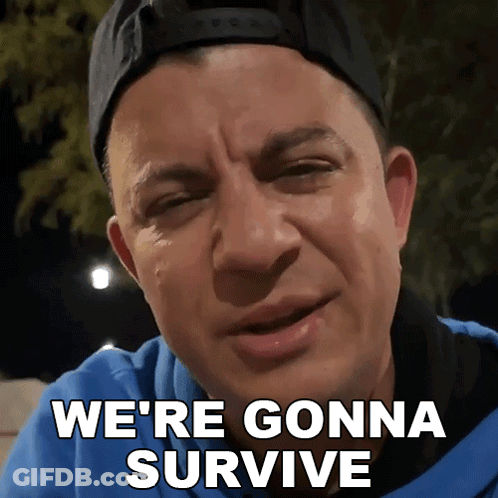 Man In Baseball Cap And Blue Shirt Says We're Gonna Survive GIF