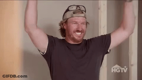 Man In Baseball Cap And Glasses Holding Arms Up GIF