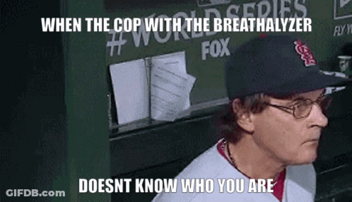 Man In Baseball Cap And Glasses Says When The Cop With The Breathalyzer GIF