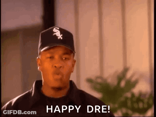 Man In Baseball Cap And Jacket Saying Happy Dre GIF