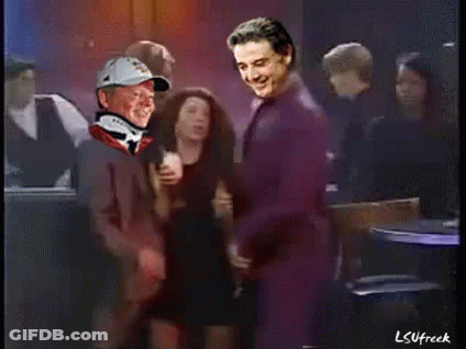 Man In Baseball Cap And Neck Brace Standing Next To Another Man GIF