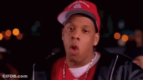 Man In Baseball Cap And Red Shirt Pointing GIF