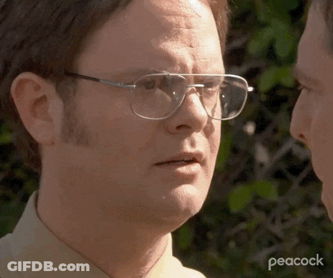 Man In Baseball Cap And Striped Shirt Writing On Face GIF