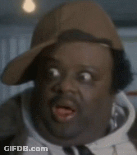 Man In Baseball Cap And Tie Making Funny Face GIF