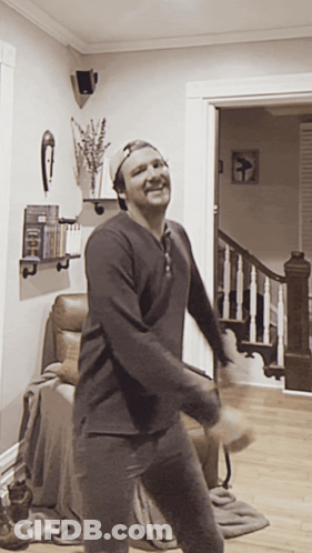 Man In Baseball Cap Dancing In Living Room GIF