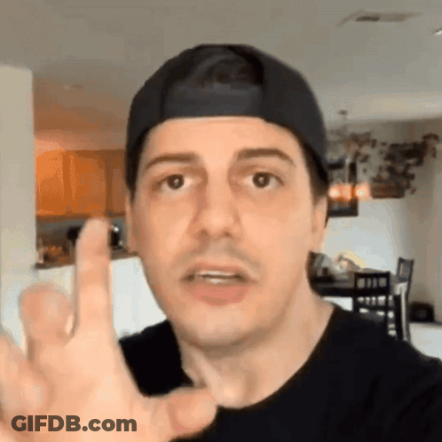 Man In Baseball Cap Giving Middle Finger GIF