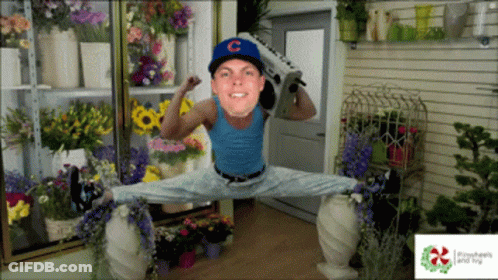 Man In Baseball Cap Holding Boombox GIF