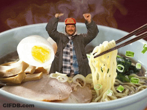 Man In Baseball Cap Holding Chopsticks Over Ramen GIF